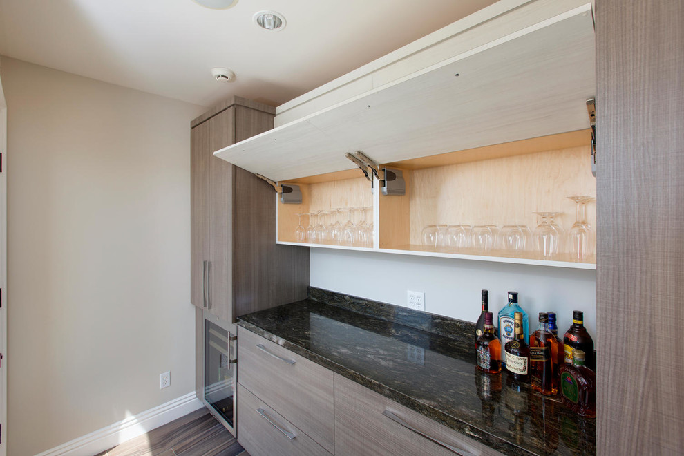 Inspiration for a contemporary home bar remodel in San Diego