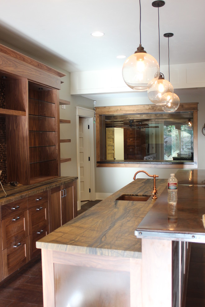 Photo of a large traditional single-wall wet bar in Salt Lake City with open cabinets, light wood cabinets, multi-coloured splashback and medium hardwood flooring.