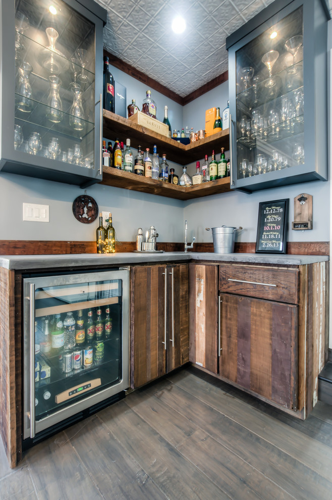 This is an example of a small classic l-shaped wet bar in Los Angeles with a submerged sink, flat-panel cabinets, distressed cabinets and concrete worktops.