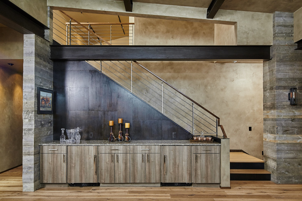 This is an example of a medium sized contemporary home bar in Other.
