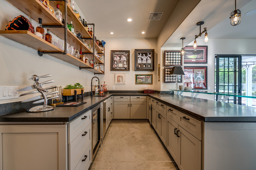 Home bar - contemporary u-shaped concrete floor and gray floor home bar idea in Phoenix with an undermount sink, shaker cabinets, gray cabinets, white backsplash and gray countertops
