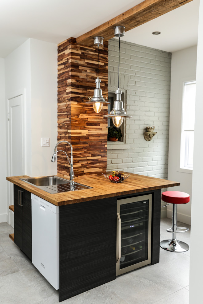 Inspiration for a small contemporary breakfast bar in Montreal with a built-in sink, flat-panel cabinets, black cabinets, wood worktops and brown worktops.