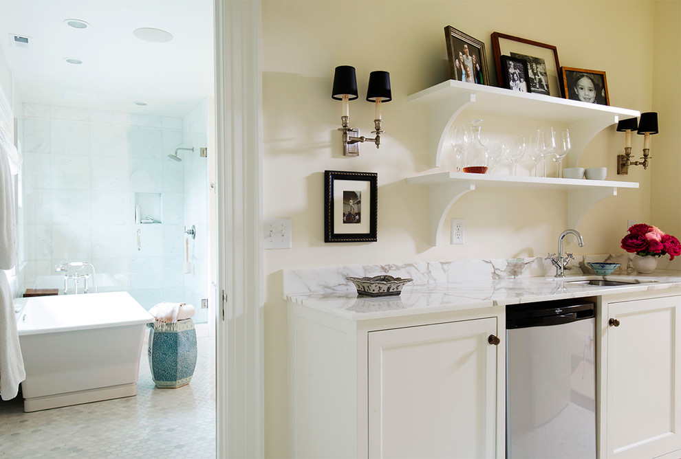 Photo of a medium sized classic single-wall wet bar in Portland with a submerged sink, recessed-panel cabinets, white cabinets and marble worktops.