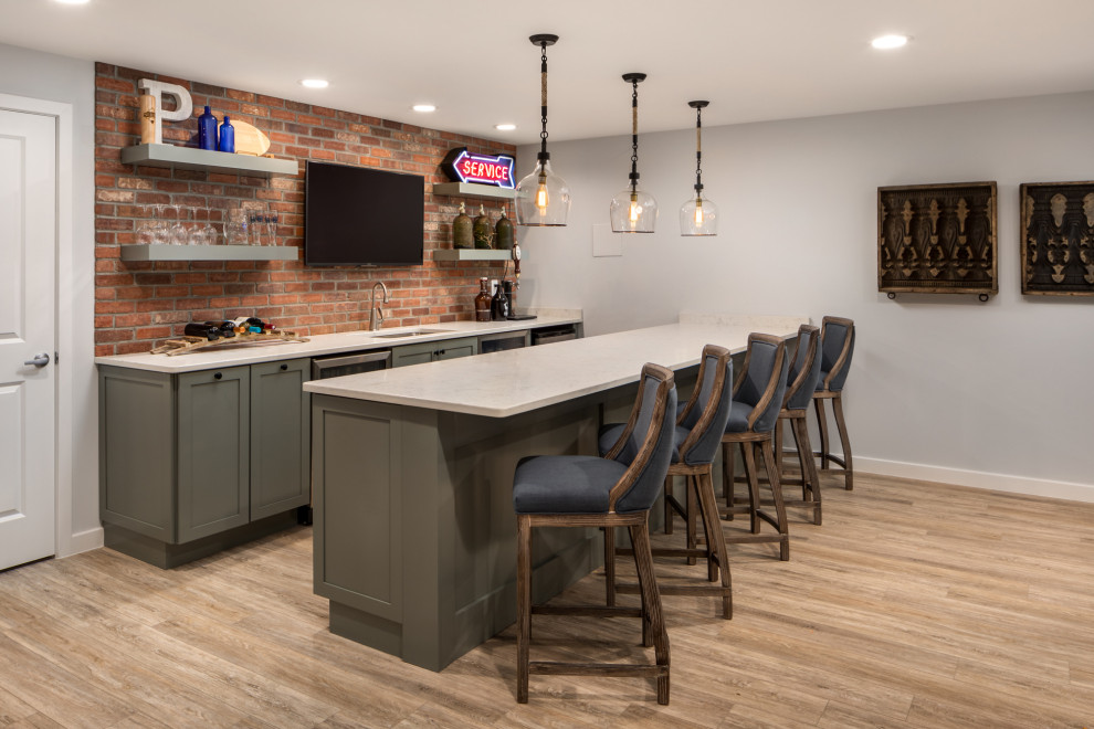 Design ideas for a medium sized industrial galley breakfast bar in DC Metro with laminate floors, brown floors, a submerged sink, shaker cabinets, grey cabinets, red splashback, brick splashback and grey worktops.