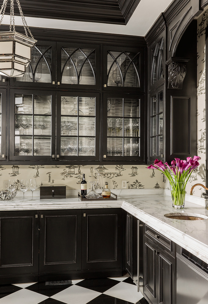 Example of a mid-sized transitional l-shaped porcelain tile and multicolored floor home bar design in Boston with an undermount sink, beaded inset cabinets, black cabinets, marble countertops and white countertops