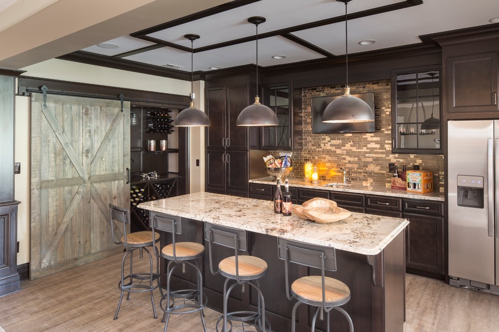 Example of a classic galley seated home bar design in Indianapolis with an undermount sink, recessed-panel cabinets, dark wood cabinets, multicolored backsplash and mosaic tile backsplash