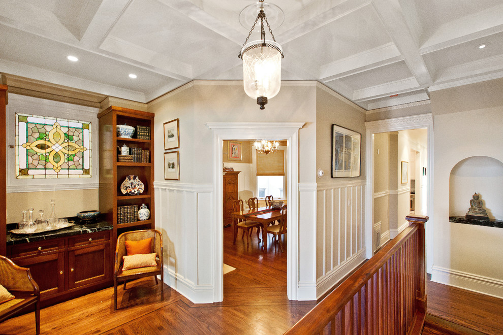 Inspiration for a mid-sized victorian single-wall dark wood floor and brown floor wet bar remodel in San Francisco with recessed-panel cabinets, dark wood cabinets, soapstone countertops and black countertops