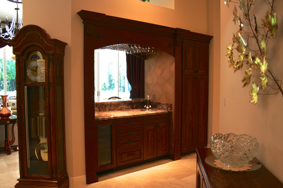 Photo of a medium sized classic single-wall wet bar in Miami with a submerged sink, raised-panel cabinets, dark wood cabinets, granite worktops and ceramic flooring.