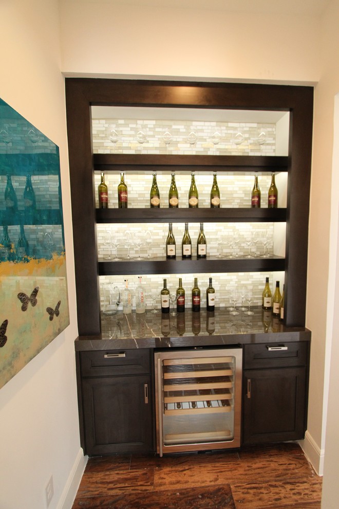Inspiration for a small classic single-wall wet bar in Austin with no sink, flat-panel cabinets, dark wood cabinets, marble worktops, multi-coloured splashback, matchstick tiled splashback and medium hardwood flooring.