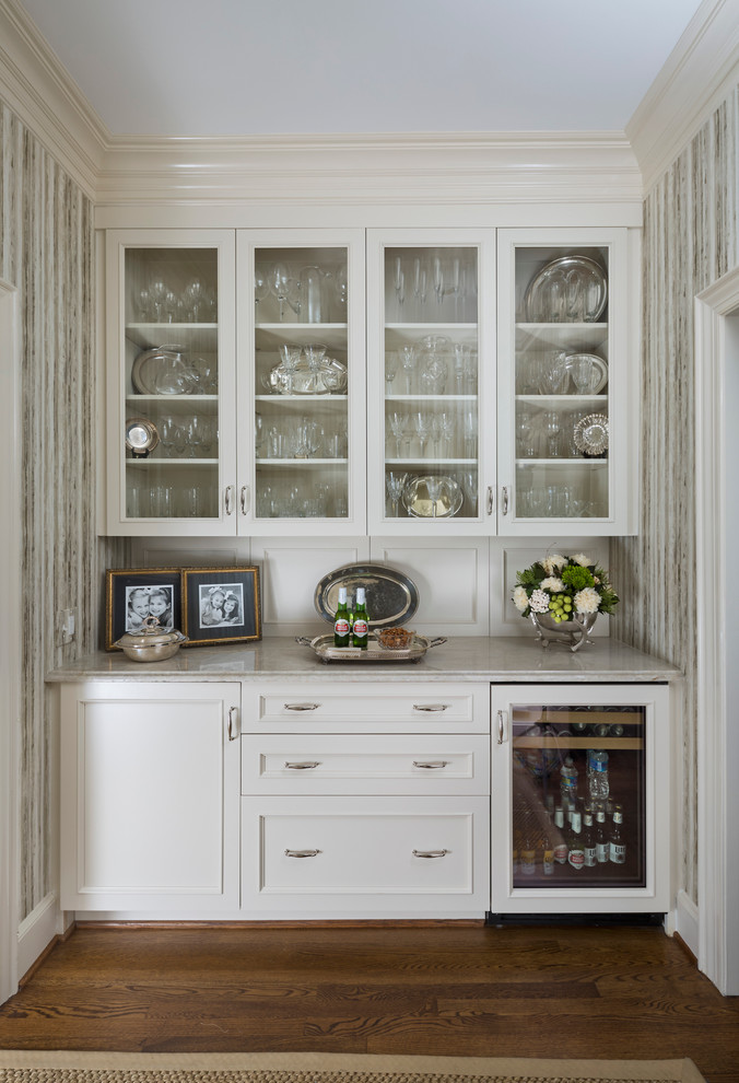 Inspiration for a small timeless single-wall home bar remodel in Charlotte
