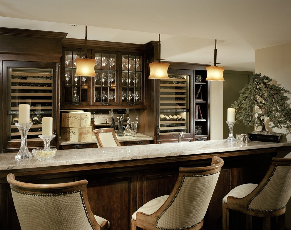 Large elegant seated home bar photo in Wilmington with glass-front cabinets, dark wood cabinets and mirror backsplash