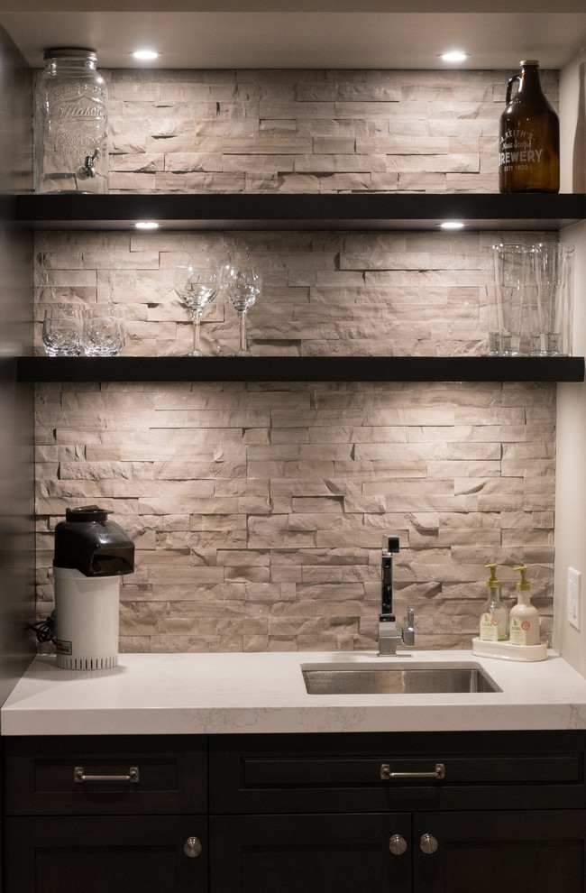 Example of a trendy home bar design in Toronto