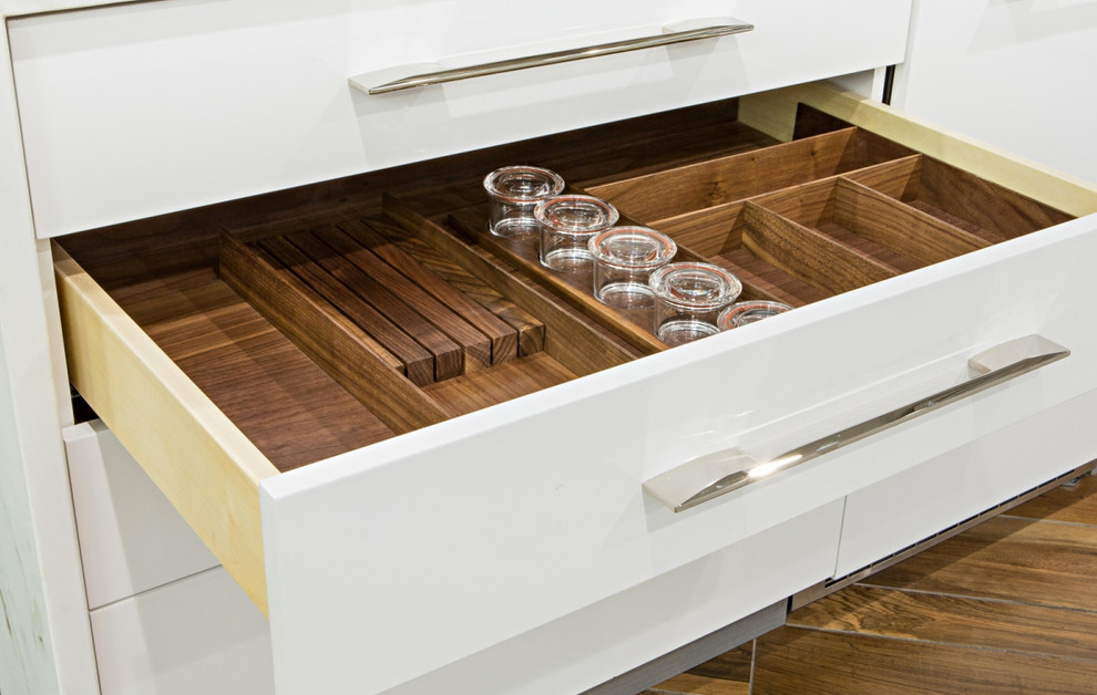 This is an example of a medium sized modern l-shaped wet bar in New York with a submerged sink, shaker cabinets, dark wood cabinets, marble worktops, multi-coloured splashback, medium hardwood flooring and brown floors.