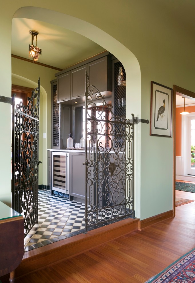 Example of a classic ceramic tile home bar design in Seattle