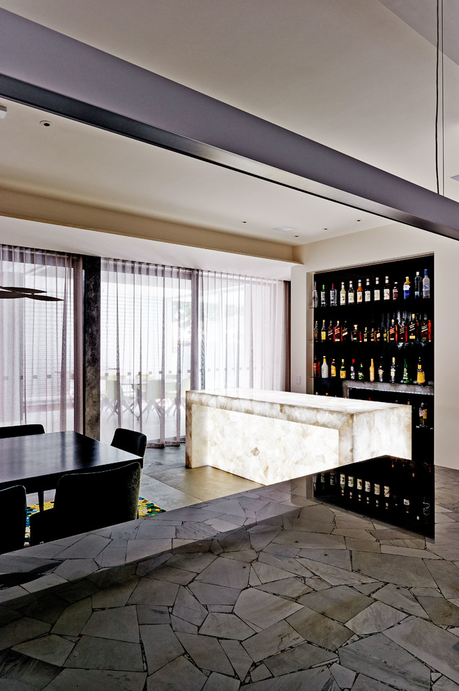 Photo of a large contemporary home bar in Melbourne.