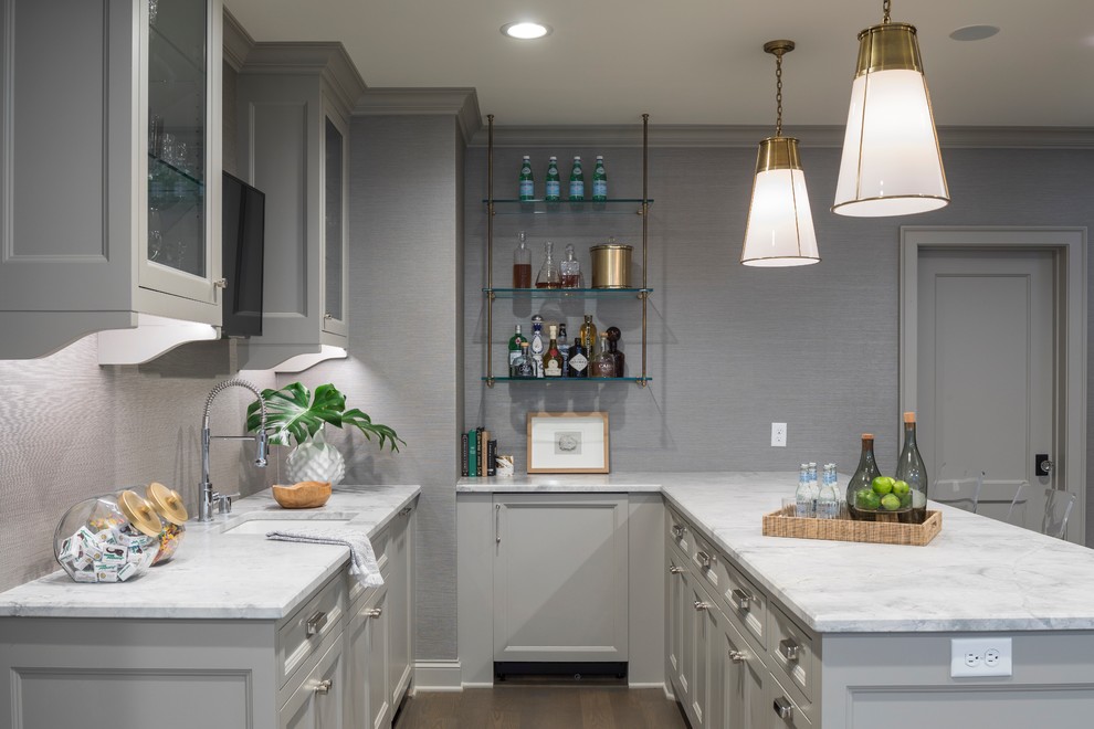 This is an example of a medium sized traditional l-shaped breakfast bar in Minneapolis with a built-in sink, marble worktops, medium hardwood flooring, brown floors and white worktops.