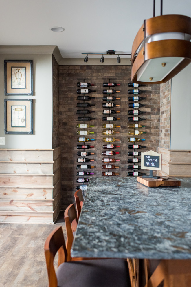 Wine cellar - mid-sized contemporary carpeted wine cellar idea in Indianapolis