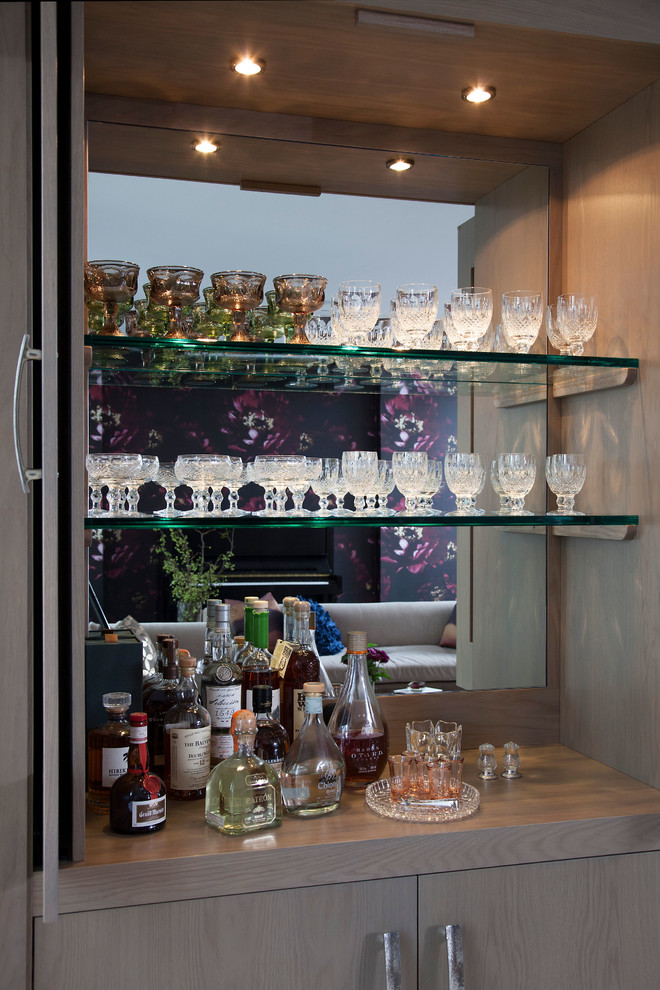 Contemporary single-wall home bar in New York with flat-panel cabinets, light wood cabinets, wood worktops, carpet, grey floors and grey worktops.