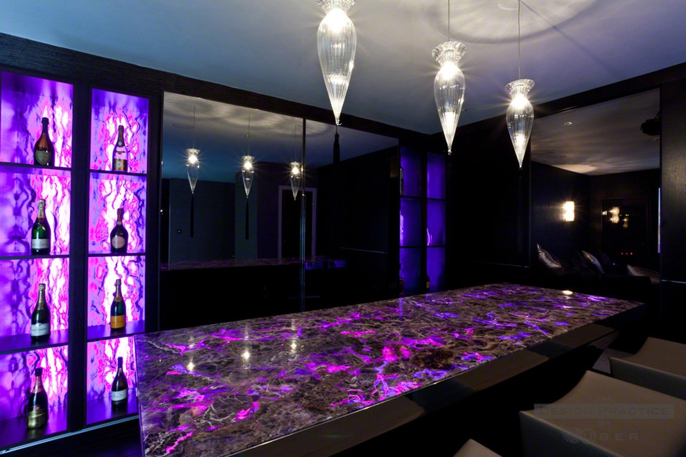 This is an example of a medium sized contemporary home bar in Manchester.