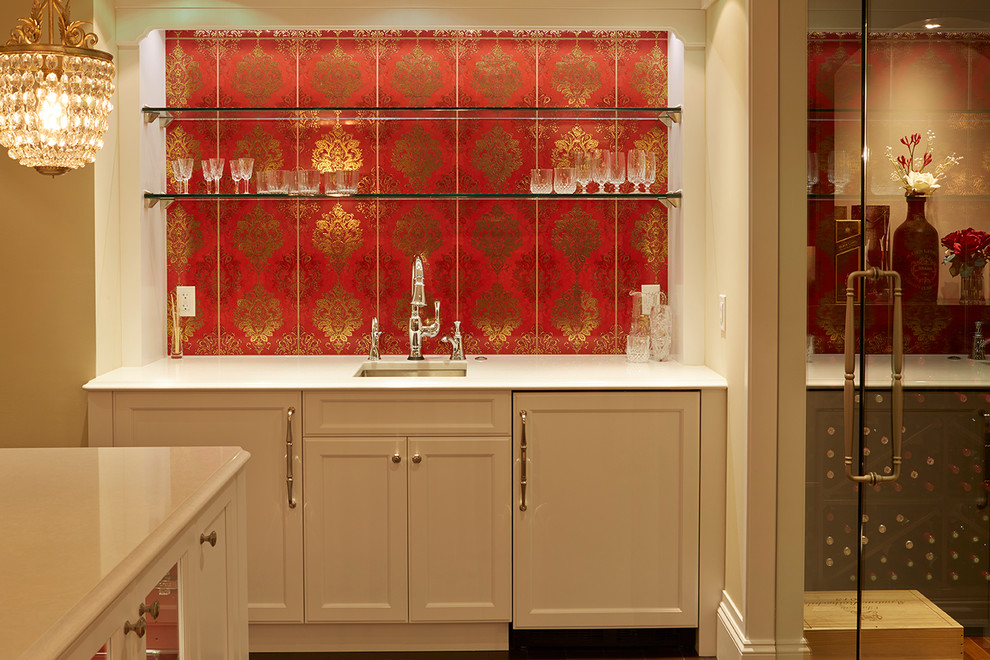 Inspiration for a large classic single-wall wet bar in Vancouver with a submerged sink, recessed-panel cabinets, white cabinets, engineered stone countertops, red splashback, ceramic splashback, dark hardwood flooring and brown floors.