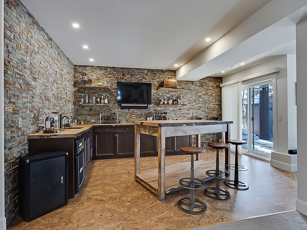 Inspiration for a small traditional l-shaped breakfast bar in Calgary with a submerged sink, shaker cabinets, dark wood cabinets, wood worktops, multi-coloured splashback, stone tiled splashback, lino flooring and brown floors.