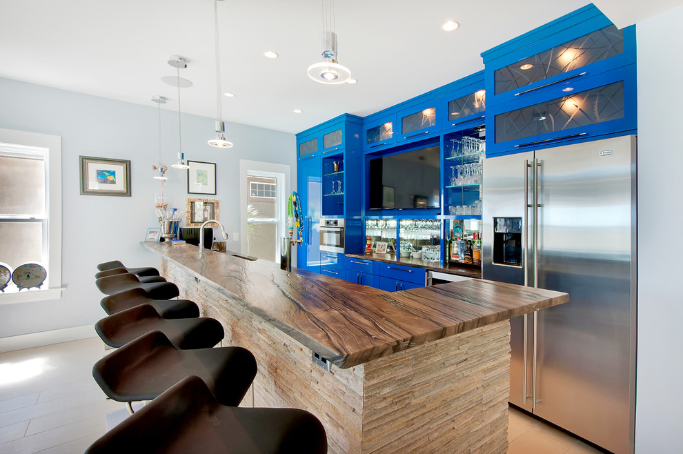 Trendy galley seated home bar photo in Other with glass-front cabinets and blue cabinets