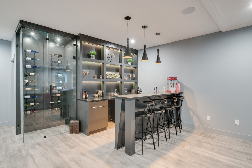 Design ideas for a medium sized contemporary single-wall breakfast bar in Vancouver with a submerged sink, open cabinets, grey cabinets, laminate floors and grey floors.