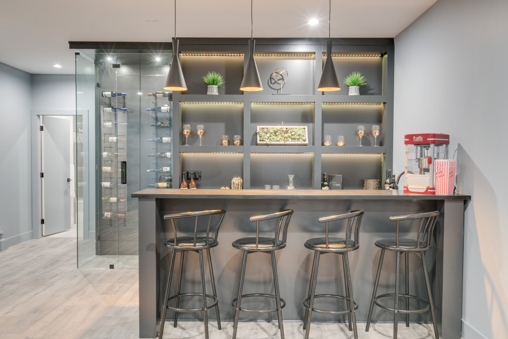 Seated home bar - mid-sized contemporary single-wall laminate floor and gray floor seated home bar idea in Vancouver with an undermount sink, open cabinets and gray cabinets