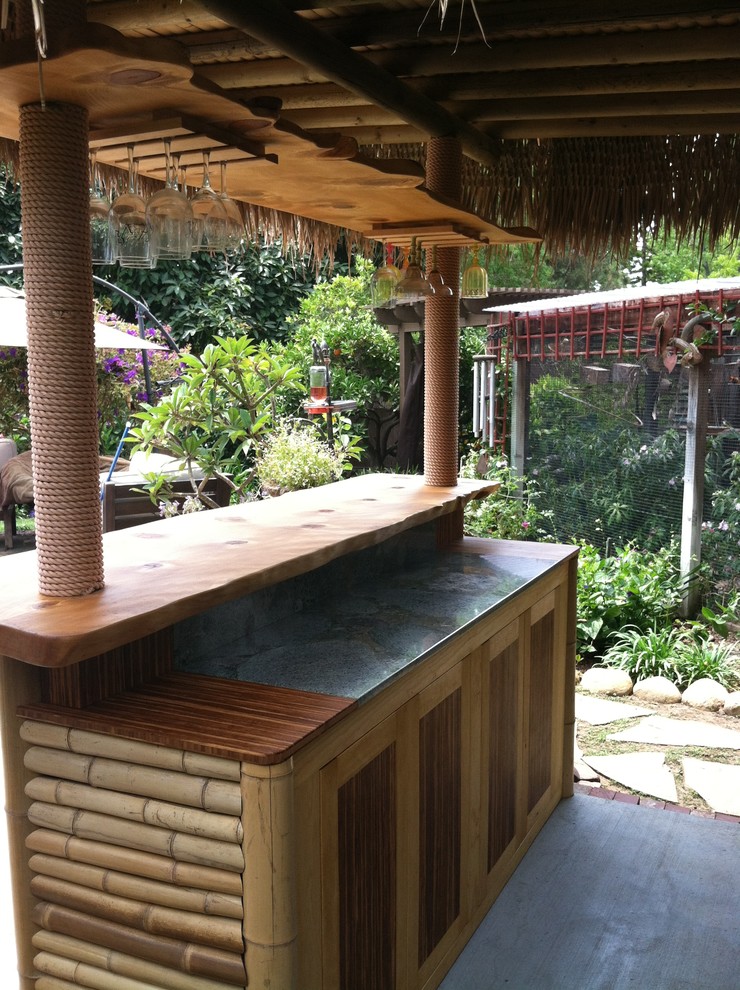 Home bar - tropical home bar idea in Santa Barbara