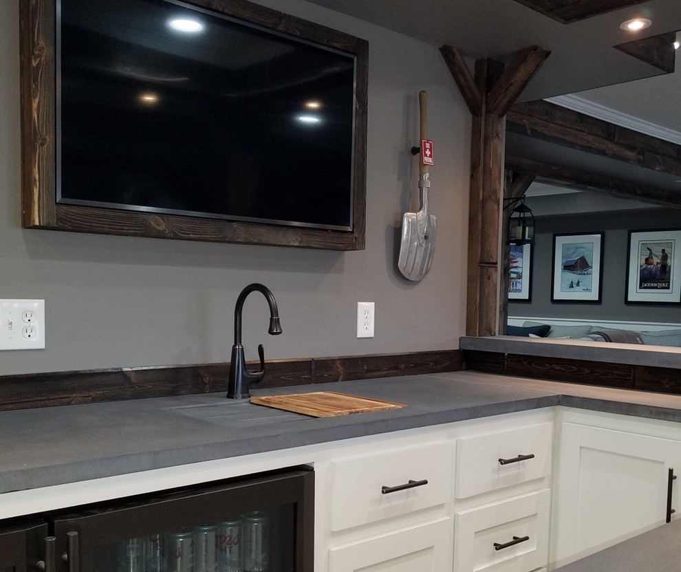 Photo of a large contemporary u-shaped breakfast bar in Minneapolis with an integrated sink, recessed-panel cabinets, white cabinets, concrete worktops, brown splashback and wood splashback.