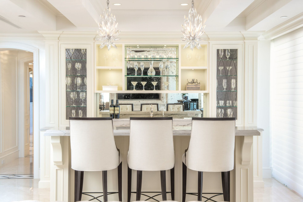 Design ideas for a medium sized classic single-wall wet bar in Tampa with a built-in sink, shaker cabinets, white cabinets, marble worktops, glass sheet splashback, marble flooring, white floors and white worktops.