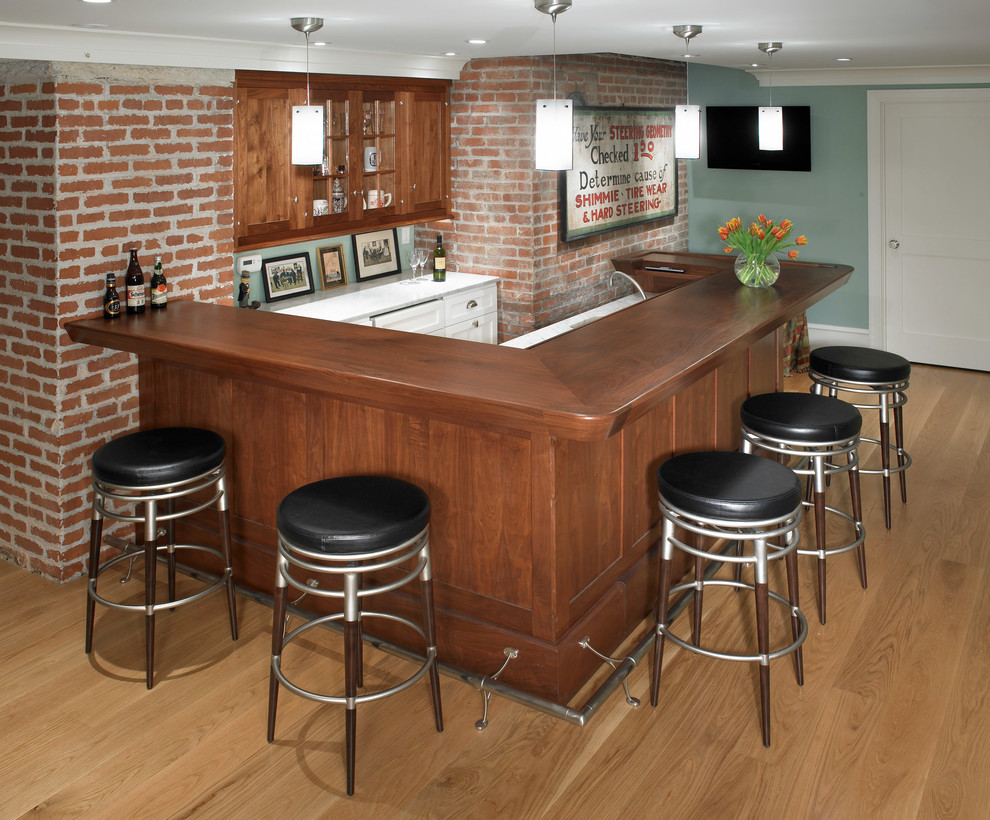 Example of a mid-sized arts and crafts u-shaped seated home bar design in Philadelphia with an undermount sink, glass-front cabinets, white cabinets and wood countertops