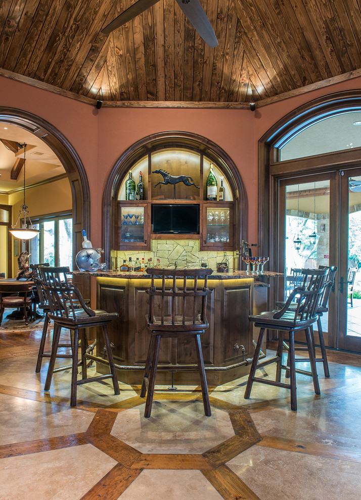 This is an example of an expansive rustic home bar in Dallas.