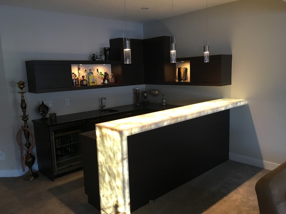 Photo of a large contemporary u-shaped wet bar in Edmonton with flat-panel cabinets, dark wood cabinets and quartz worktops.