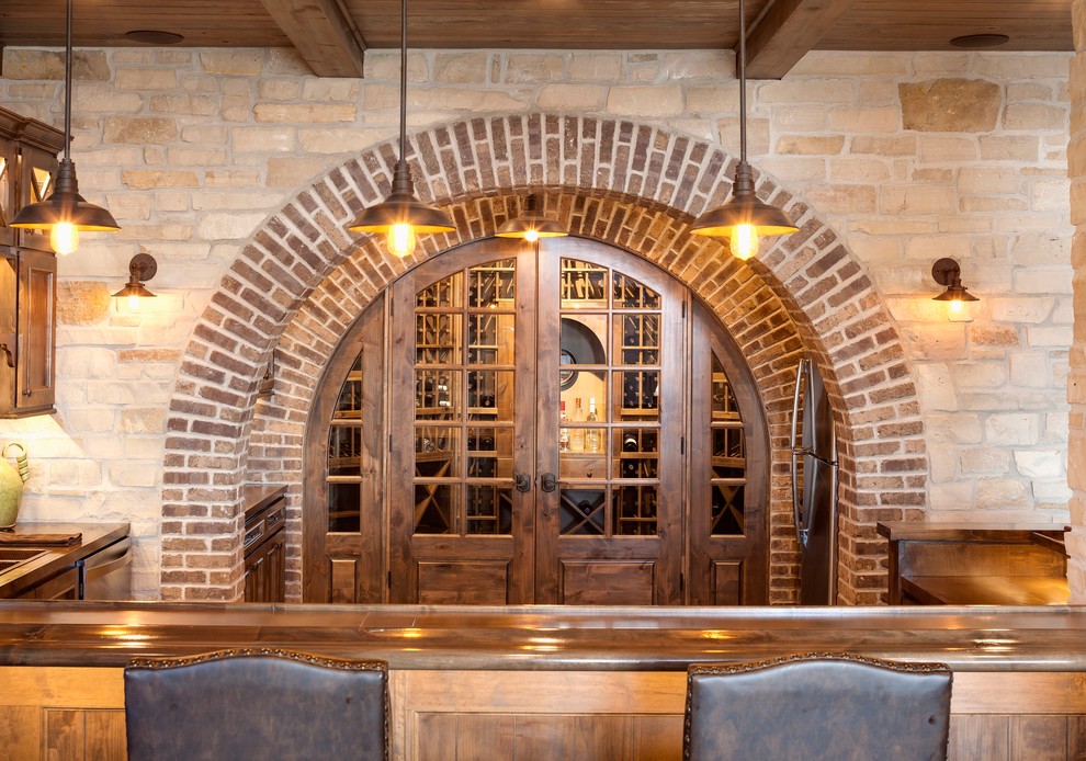Photo of a large rustic wine cellar in Chicago.