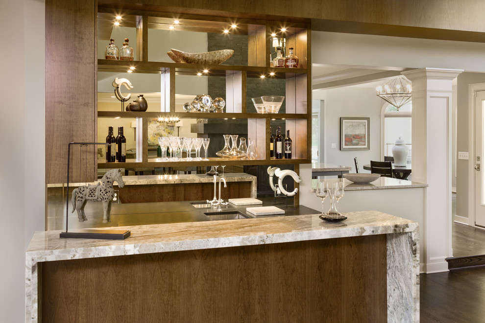 Seated home bar - mid-sized modern single-wall dark wood floor seated home bar idea in Cleveland with an undermount sink, open cabinets, medium tone wood cabinets and marble countertops
