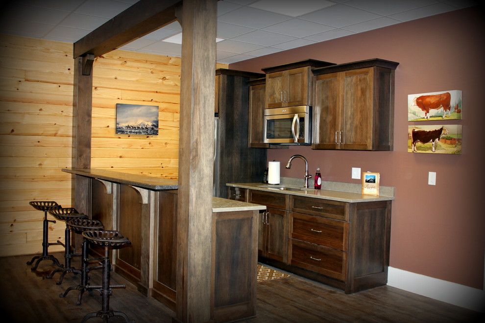 Inspiration for a rustic vinyl floor home bar remodel in Nashville with an undermount sink, shaker cabinets, dark wood cabinets and granite countertops
