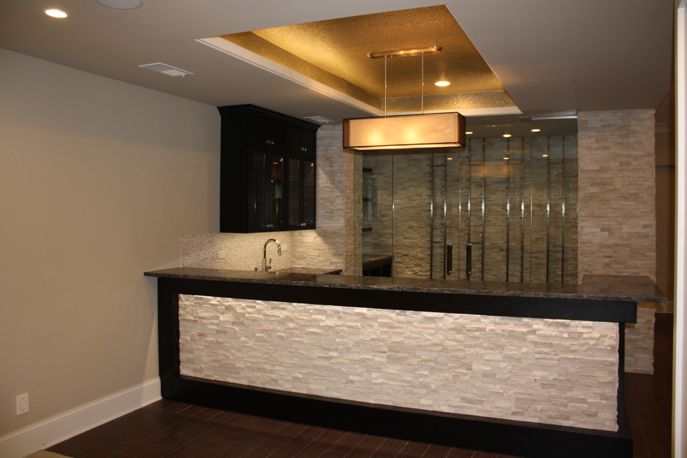 This is an example of a large classic home bar in Chicago.