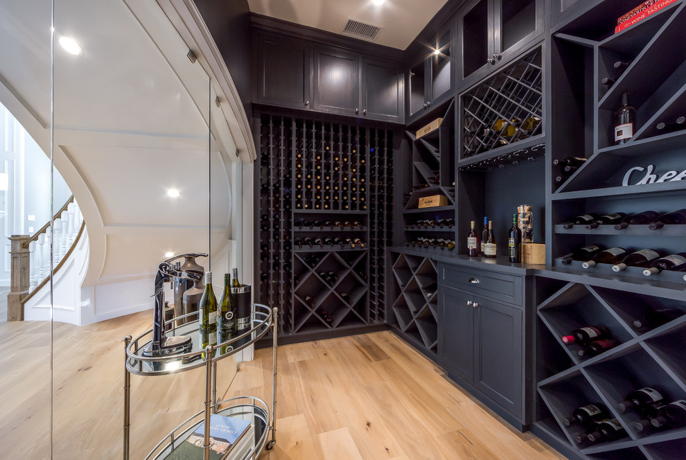 Design ideas for a small traditional wine cellar in Los Angeles with light hardwood flooring and brown floors.