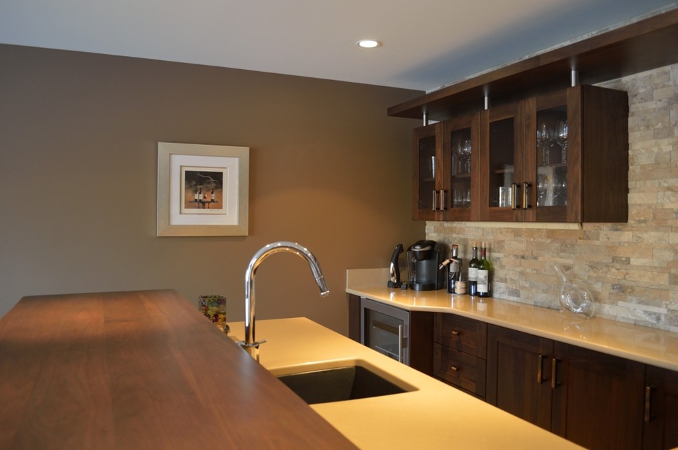 Contemporary l-shaped breakfast bar in New York with a submerged sink, glass-front cabinets, dark wood cabinets, wood worktops, multi-coloured splashback, stone tiled splashback and lino flooring.