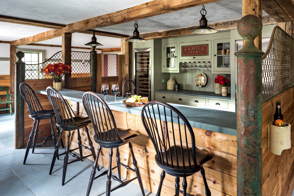 This is an example of an expansive farmhouse galley breakfast bar in New York with glass-front cabinets, green cabinets, green splashback and brown worktops.