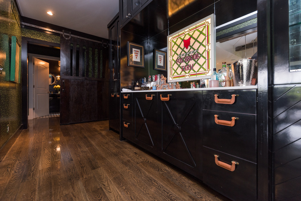 Rural home bar in Louisville with black cabinets, marble worktops, mirror splashback and dark hardwood flooring.