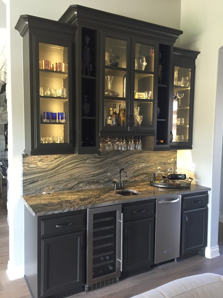 Inspiration for a transitional single-wall light wood floor wet bar remodel in Oklahoma City with an undermount sink, flat-panel cabinets, gray cabinets, granite countertops, multicolored backsplash and stone slab backsplash
