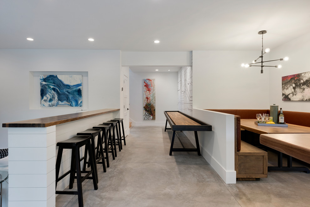 Réalisation d'un bar de salon minimaliste de taille moyenne avec sol en béton ciré et un sol gris.
