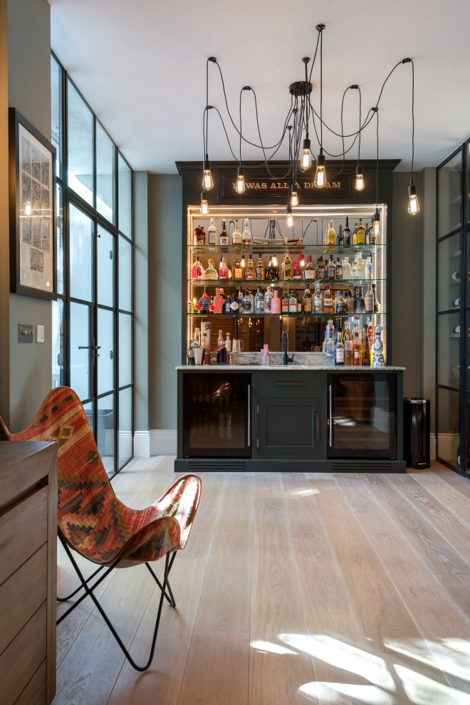 Photo of a contemporary home bar in London.