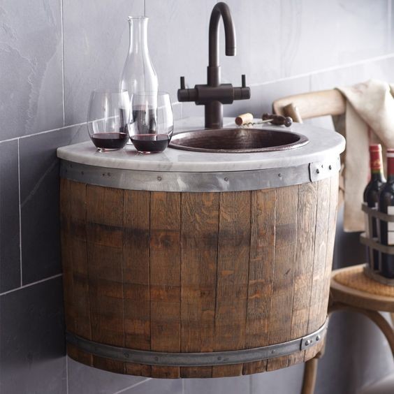 Inspiration for a small rural wet bar in New York with a built-in sink, distressed cabinets, marble worktops and grey splashback.