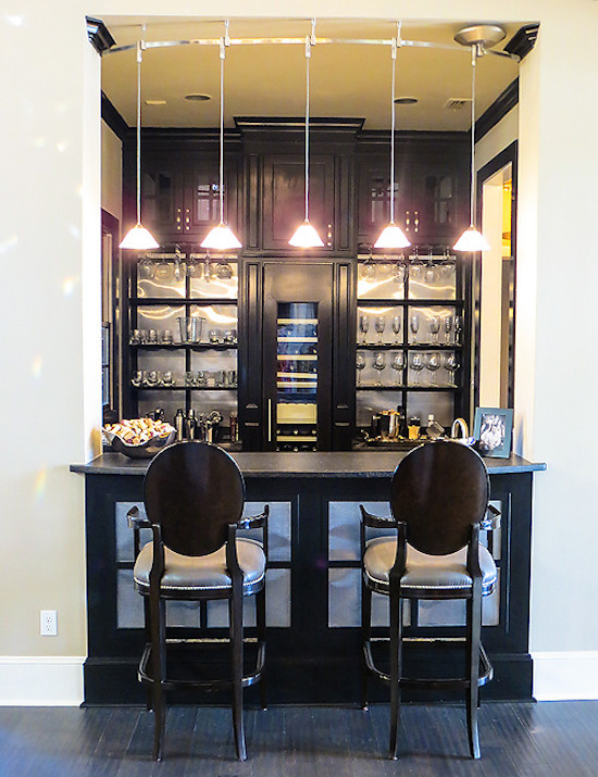 Design ideas for a small contemporary galley breakfast bar in Austin with black cabinets.