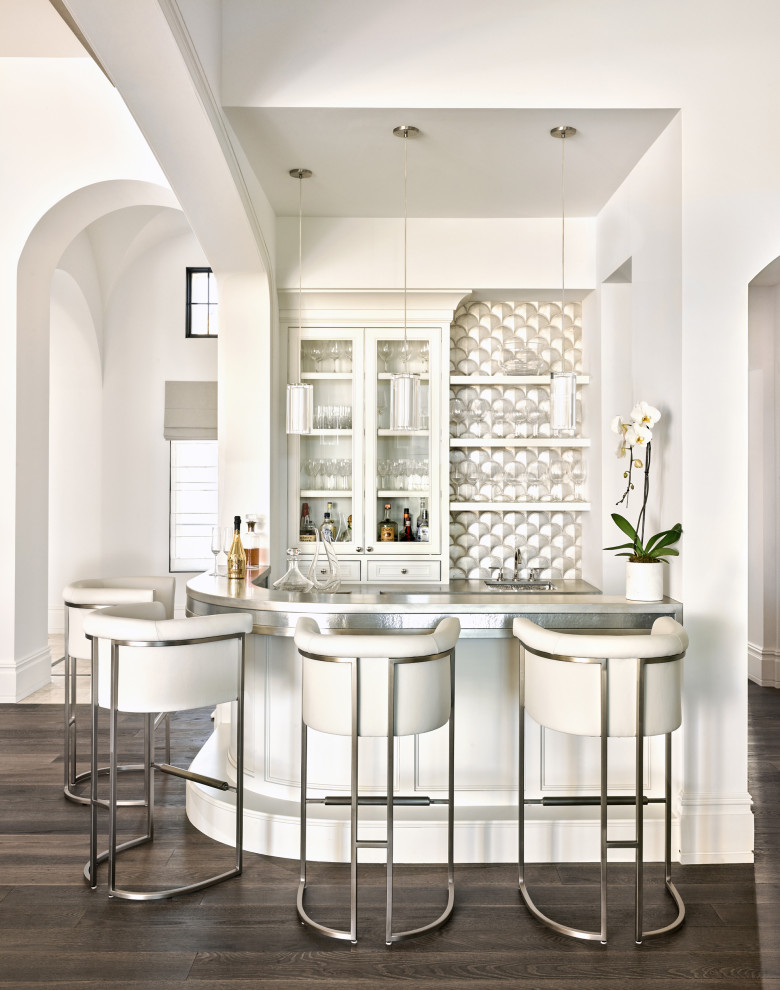 Seated home bar - mediterranean u-shaped dark wood floor and brown floor seated home bar idea in Phoenix with glass-front cabinets, white cabinets and gray countertops