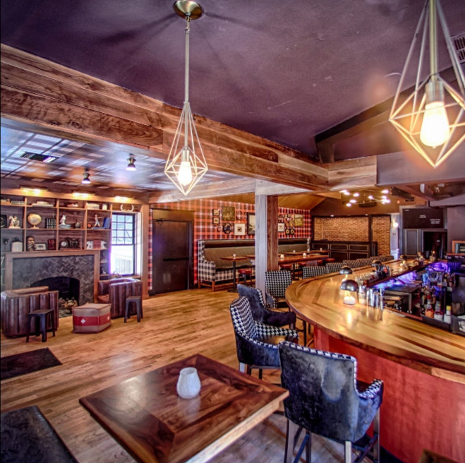 Photo of a bohemian home bar in Atlanta.
