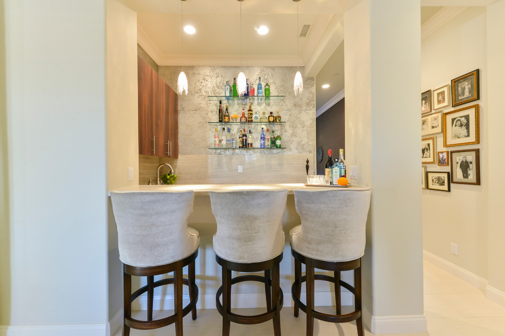 Example of a trendy home bar design in Omaha